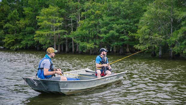In a row boat on Chicot Lake in Arkansas fishing for catfish.