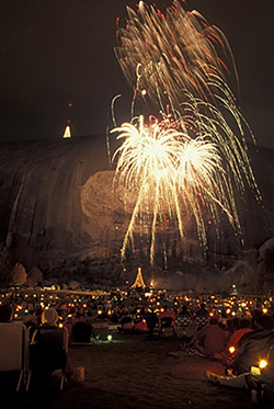 if1157 fireworks laser show stone mountain atlanta ga georgia crowd of people watch the christmas holiday laser show and fireworks display from the lawn at georgias stone mountain park in stone mountain